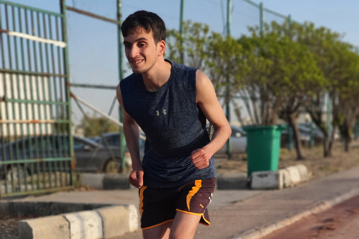 Hasan is running in the Amman Marathon, looking energetic and determined